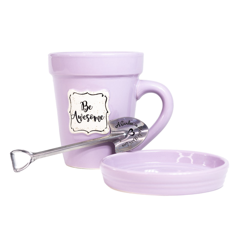 A Lilac Flower Pot Mug - Be Awesome by Nicole Brayden with a spoon in it.