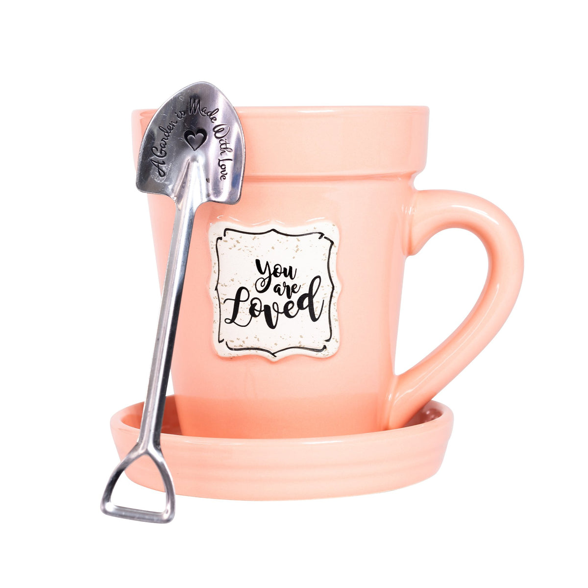A Peach Flower Pot Mug - You Are Loved from Nicole Brayden with a spoon in it.