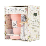 A Nicole Brayden Peach Flower Pot Mug - You Are Loved with a spoon inside of it.