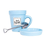 A Nicole Brayden Blue Flower Pot Mug - Best Friend with a spoon in it.
