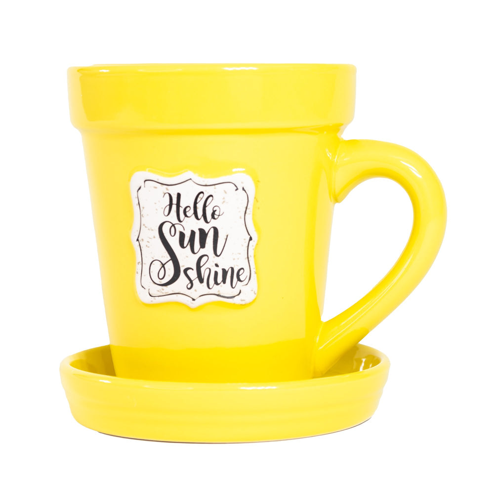 Hello Nicole Brayden mug and saucer set. This set features a charming Nicole Brayden Yellow Flower Pot Mug - Hello Sunshine, perfect for sipping your favorite beverage and brightening up your day. Experience the joy of sunshine with this delightful Nicole Brayden Yellow Flower Pot Mug - Hello Sunshine.