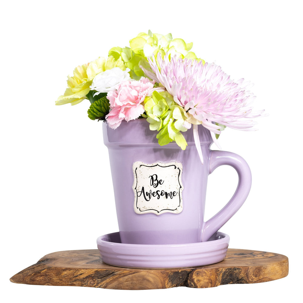 A Lilac Flower Pot Mug - Be Awesome by Nicole Brayden with a bouquet of flowers in it.
