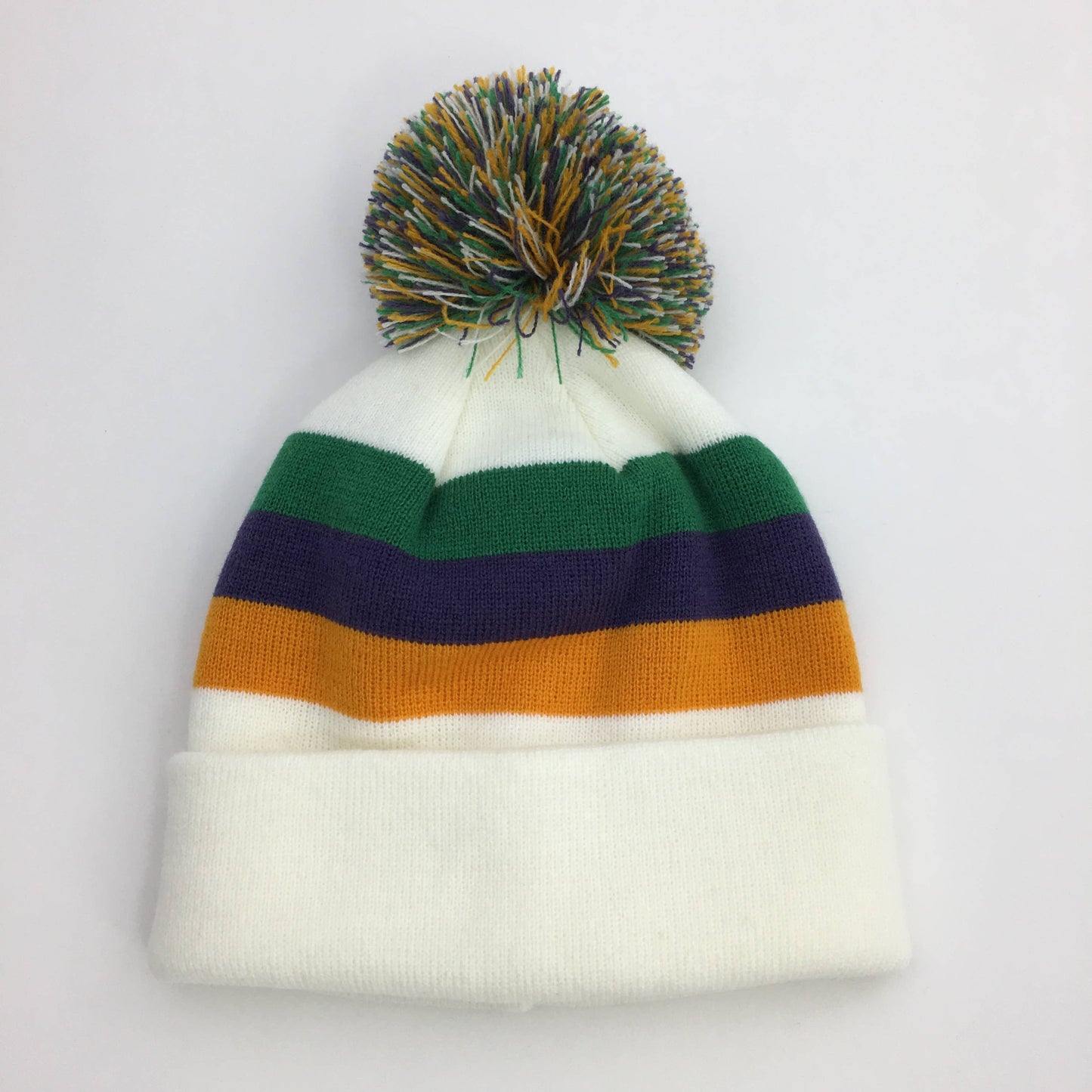 A SongLily Mardi Gras striped beanie hat with a pompom, perfect for Mardi Gras festivities.