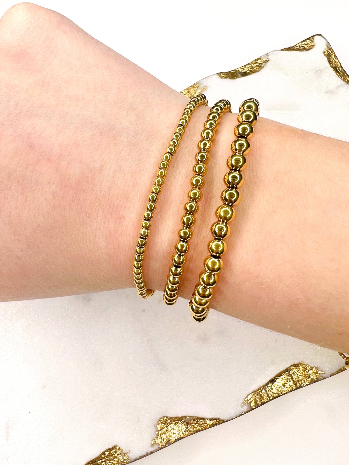 Three Kyra Beaded Bracelet Sets from Lacey Rae Jewelry on a woman's wrist.