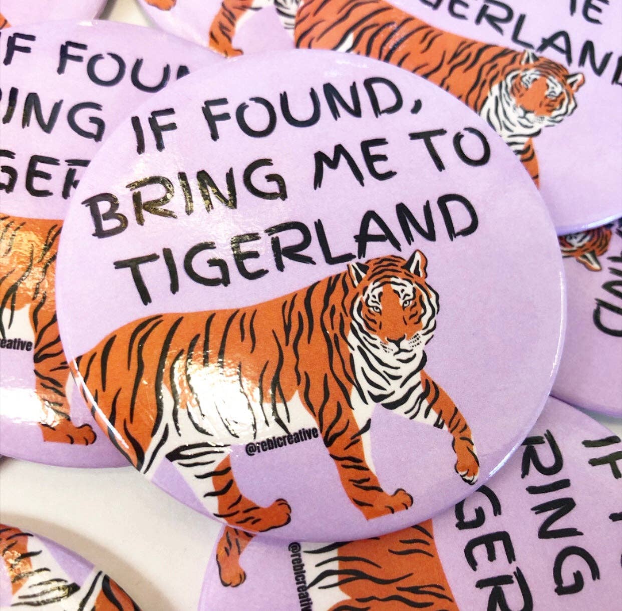 If found, bring me to REBL Creative's Tigerland game day button.