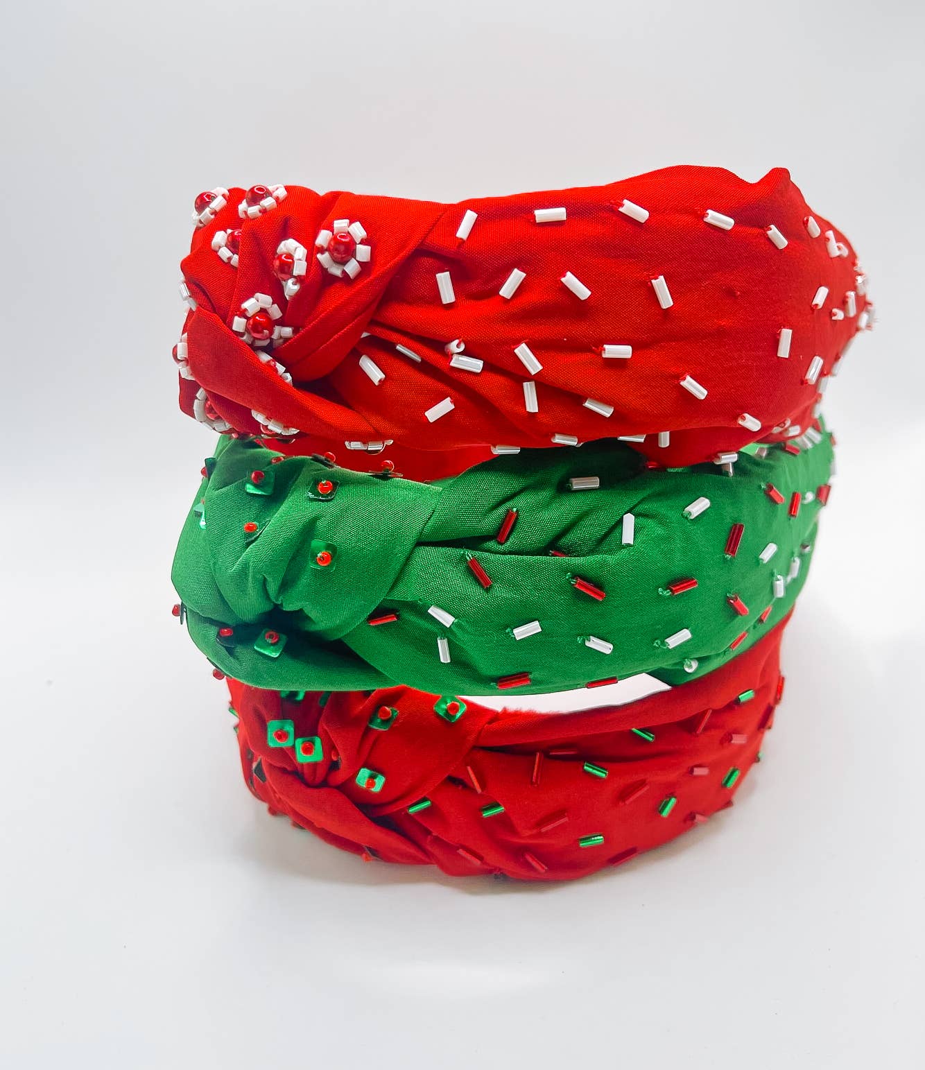 Three Bash Christmas Beaded Headbands with Red Fabric and Green Red Sprinkles, perfect for holiday festivities.