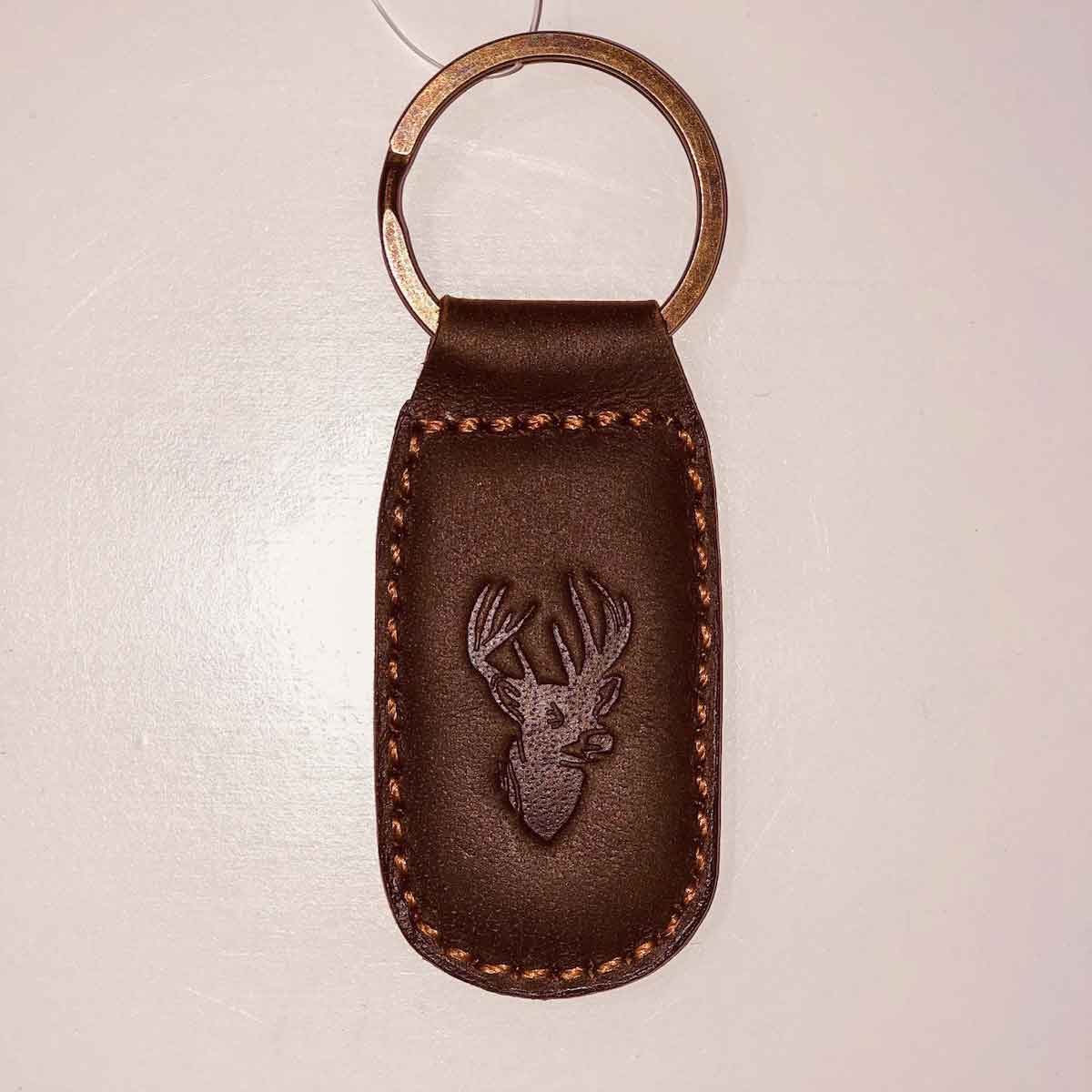 A Royal Standard Deer Leather Embossed Keychain with a deer head on it.